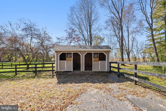 view of outdoor structure with a rural view