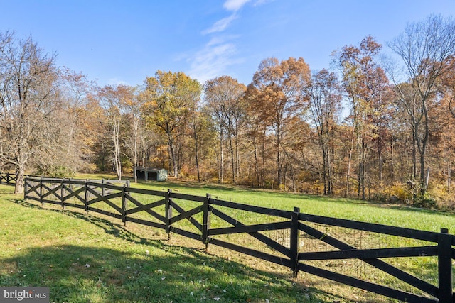 view of gate featuring a lawn