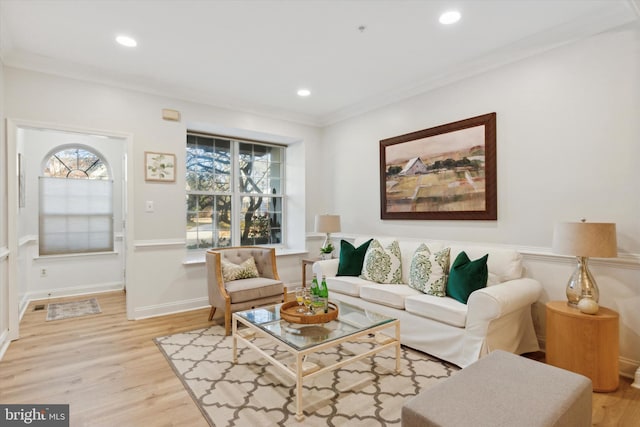 living room with hardwood / wood-style floors and ornamental molding