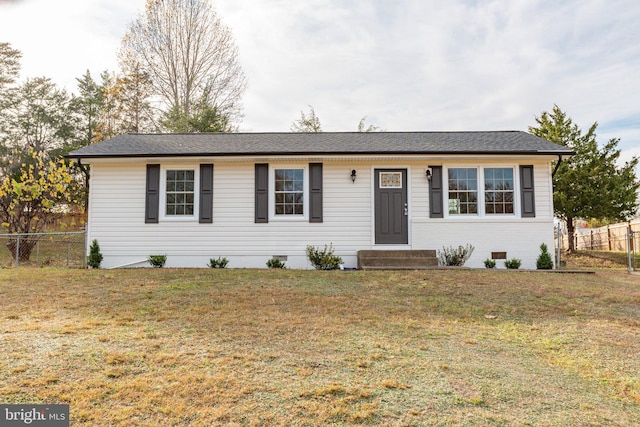 single story home featuring a front lawn