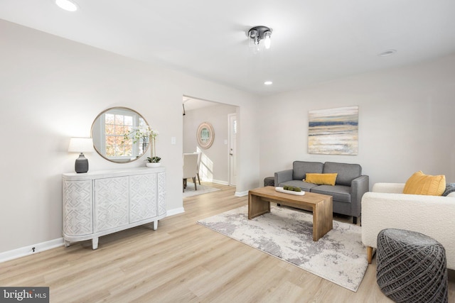 living room with light hardwood / wood-style flooring