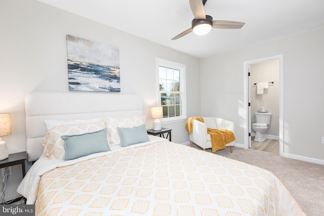 carpeted bedroom with ceiling fan and ensuite bathroom