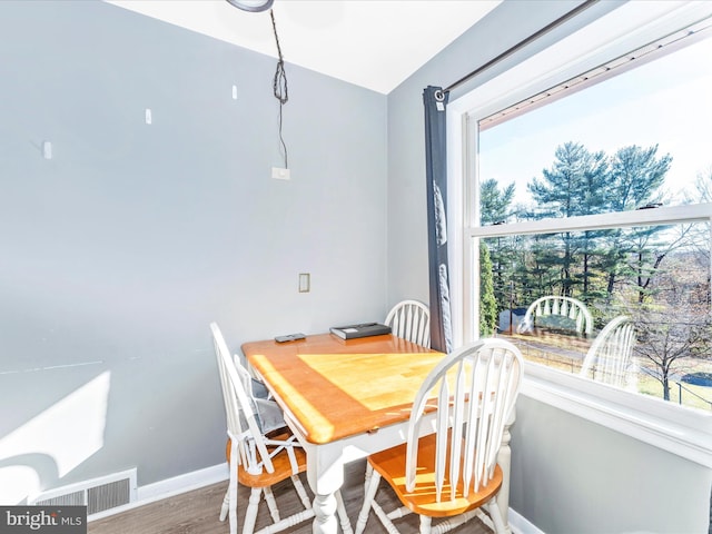 dining area featuring hardwood / wood-style floors