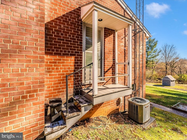 doorway to property featuring central air condition unit