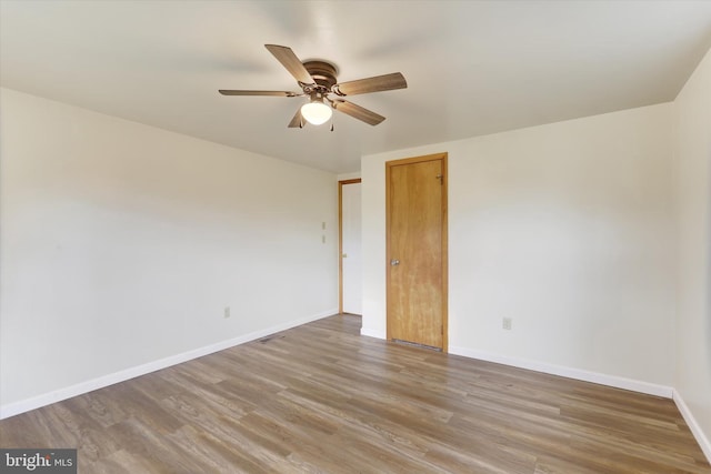 unfurnished bedroom featuring ceiling fan and wood-type flooring