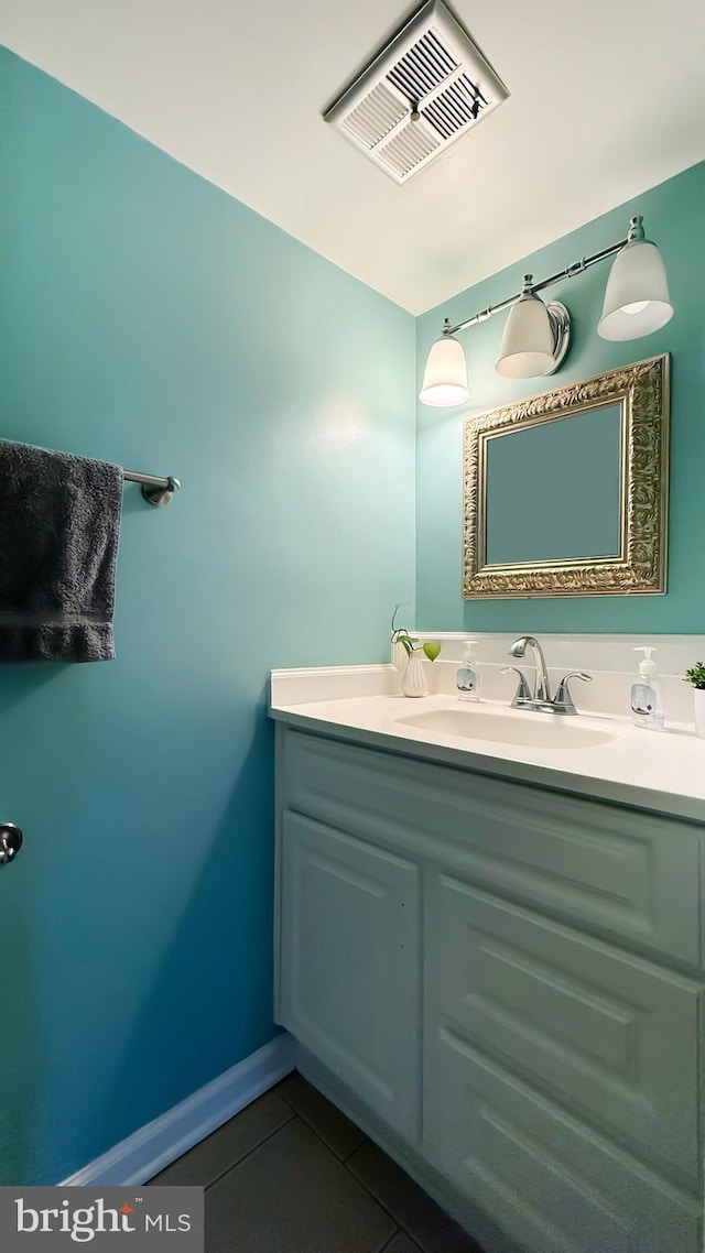 bathroom featuring tile patterned flooring and vanity