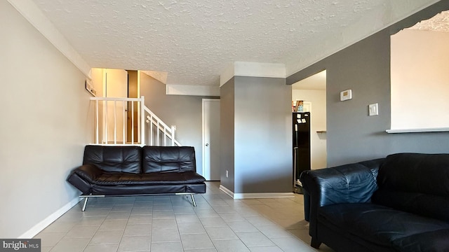 tiled living room with a textured ceiling