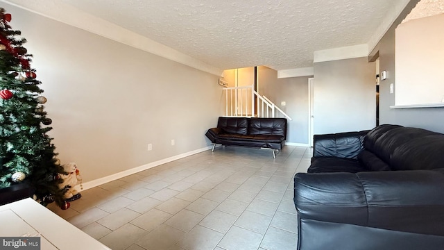 tiled living room with a textured ceiling