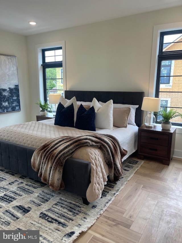 bedroom featuring light parquet flooring