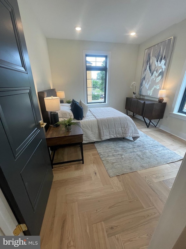 bedroom featuring light parquet floors