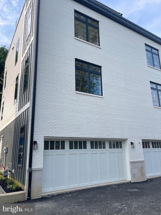 view of property exterior with a garage