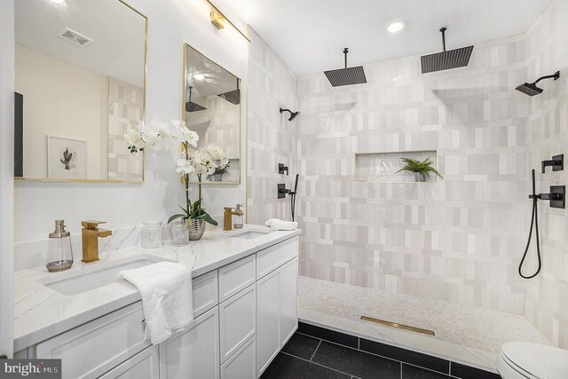 7519 Ridge Rdg Unit 204, Philadelphia, PA 19128 - bathroom with tile patterned flooring, double vanity, tiled shower, toilet, and recessed lighting