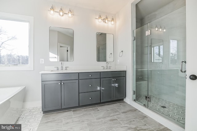 bathroom featuring vanity and shower with separate bathtub