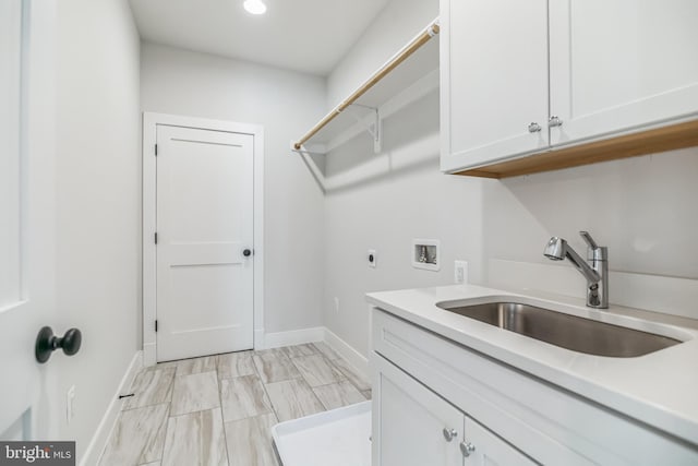 laundry room featuring cabinets, washer hookup, sink, and electric dryer hookup