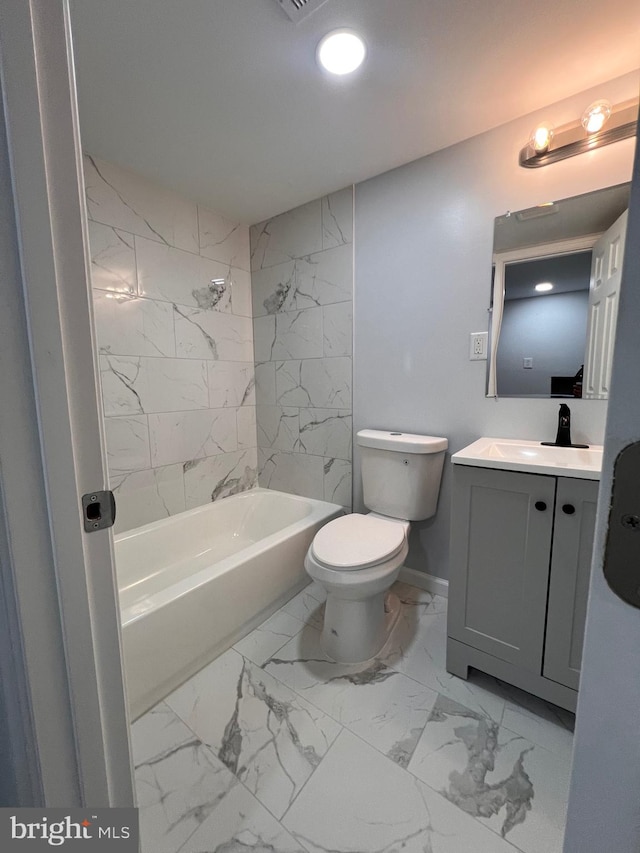 full bathroom featuring vanity, toilet, and tiled shower / bath combo