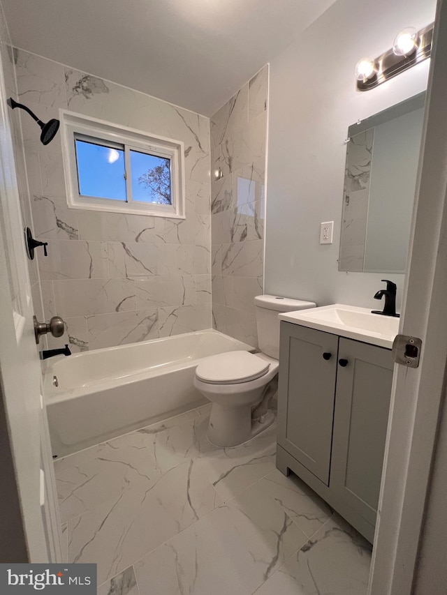 full bathroom with vanity, toilet, and tiled shower / bath