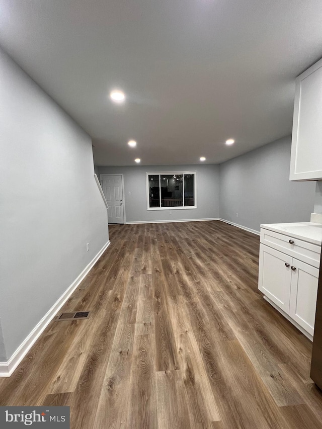 unfurnished living room featuring hardwood / wood-style floors