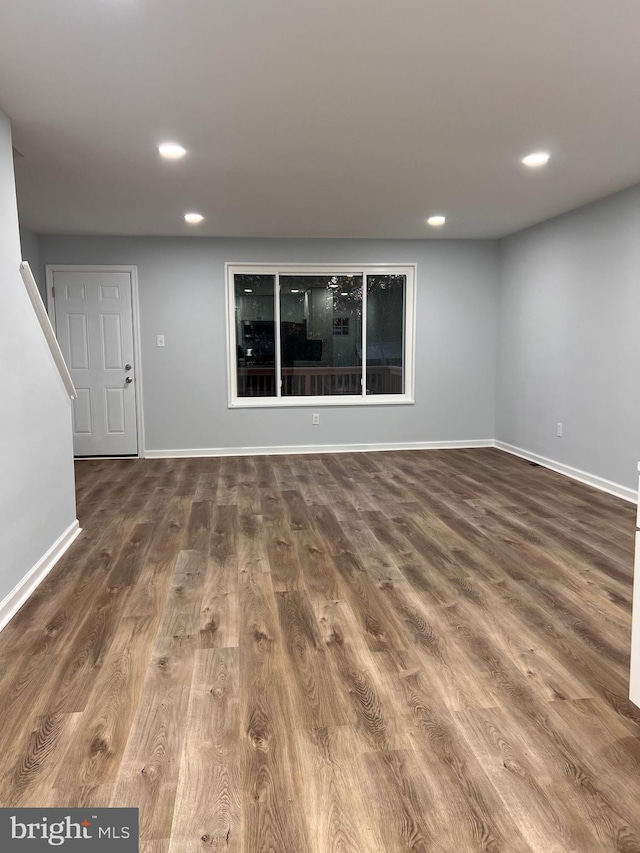 unfurnished living room with hardwood / wood-style flooring