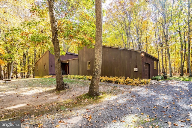 view of side of home with a garage