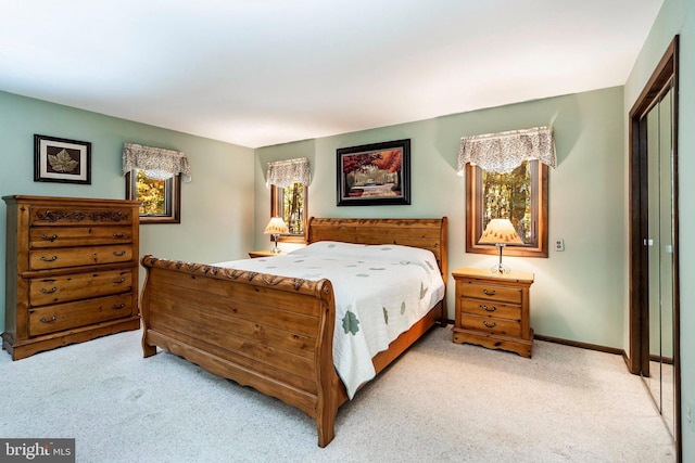 carpeted bedroom with a closet