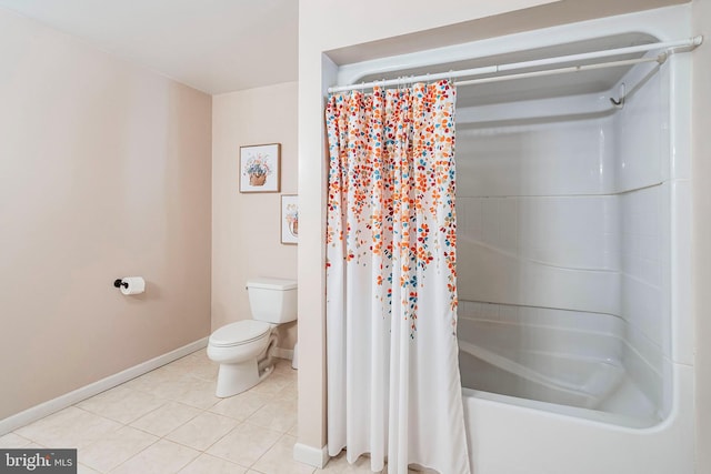 bathroom featuring toilet, shower / bath combo, and tile patterned floors