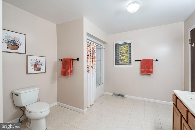 full bathroom featuring tile patterned flooring, vanity, toilet, and shower / tub combo