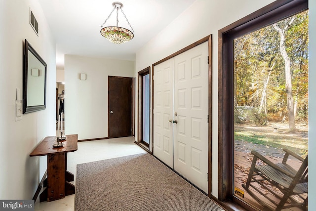 foyer featuring carpet floors