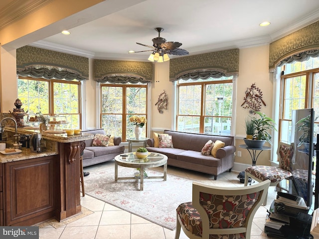 tiled living room featuring ceiling fan, plenty of natural light, and ornamental molding