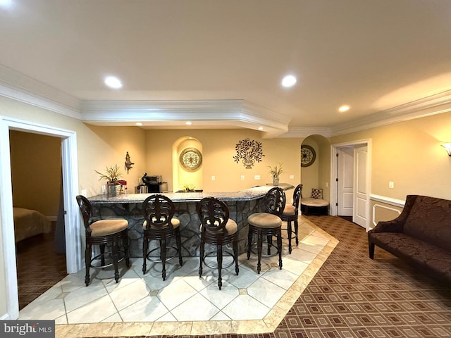 bar featuring crown molding