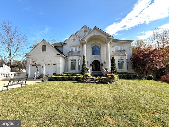 view of front of home with a front lawn, a garage, and a balcony