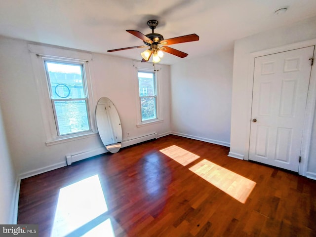 interior space featuring ceiling fan, a baseboard radiator, and dark hardwood / wood-style flooring