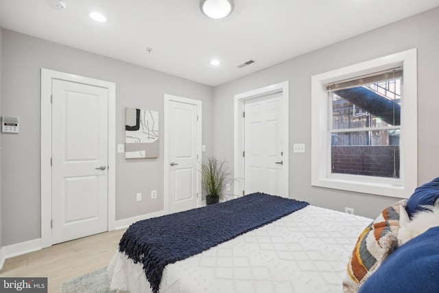 bedroom with light hardwood / wood-style flooring