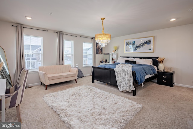 bedroom featuring carpet flooring and an inviting chandelier