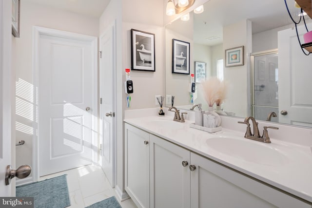 bathroom featuring vanity and a shower with shower door