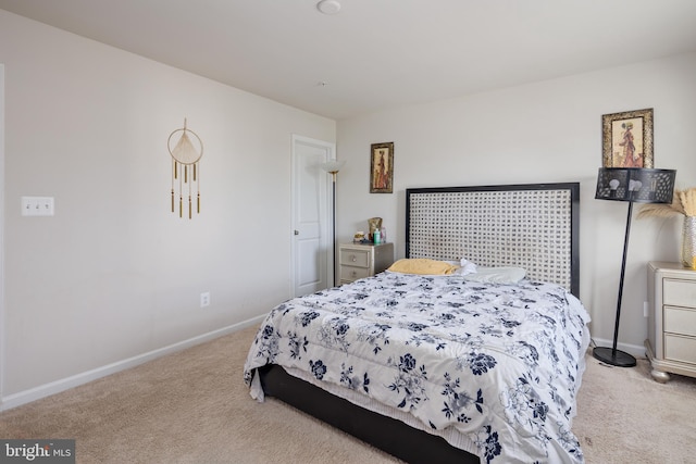 bedroom with light colored carpet