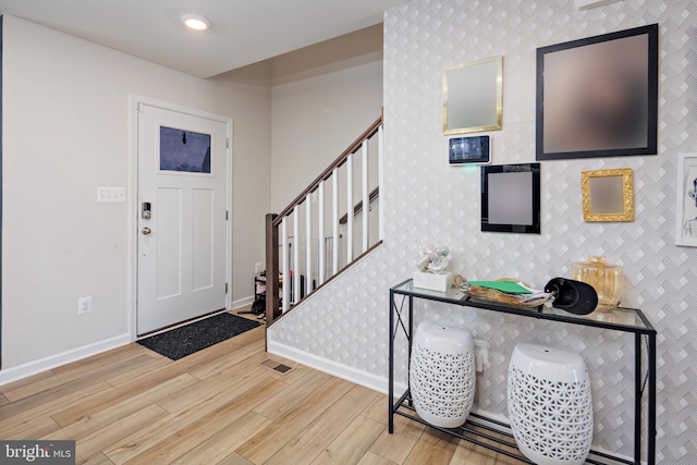 foyer with light hardwood / wood-style floors