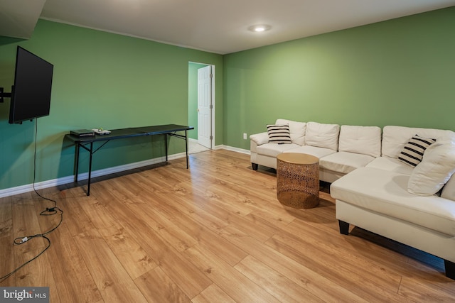 living room with light hardwood / wood-style flooring