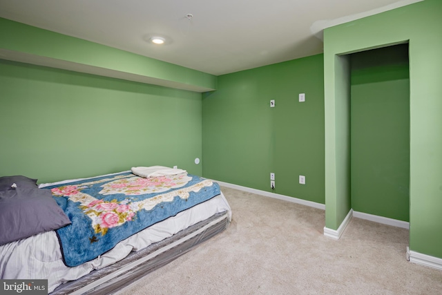 bedroom with light colored carpet