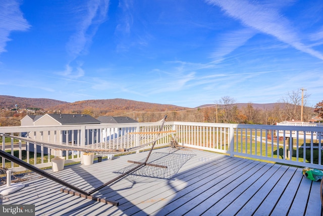 wooden terrace with a mountain view