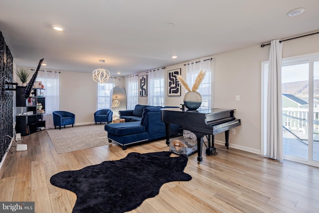 living room with plenty of natural light and light hardwood / wood-style floors