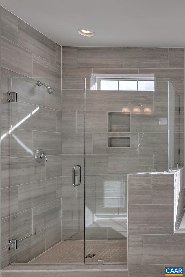 bathroom with an enclosed shower