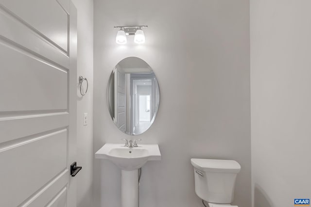 bathroom featuring sink and toilet