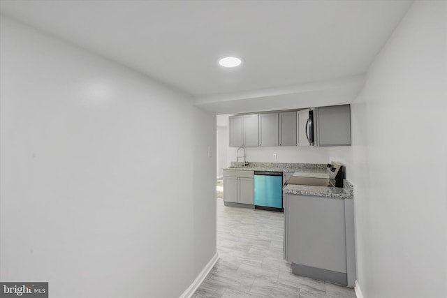 kitchen featuring gray cabinetry, appliances with stainless steel finishes, and sink