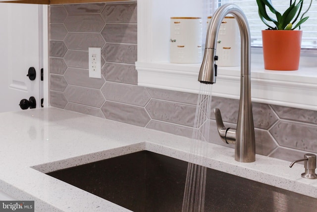 interior details with light stone counters and sink