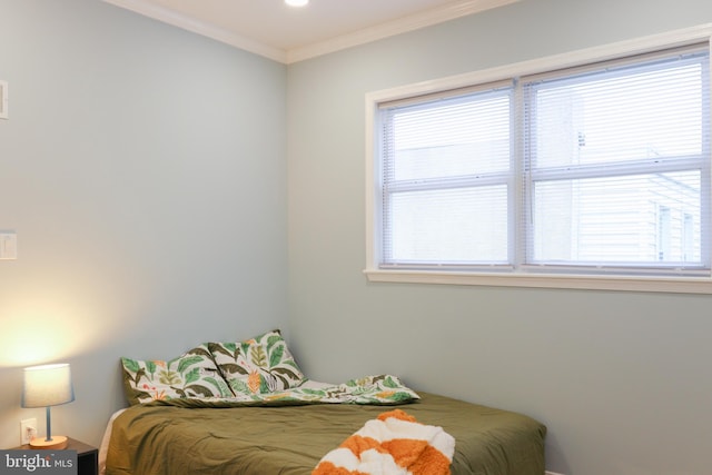 bedroom featuring crown molding