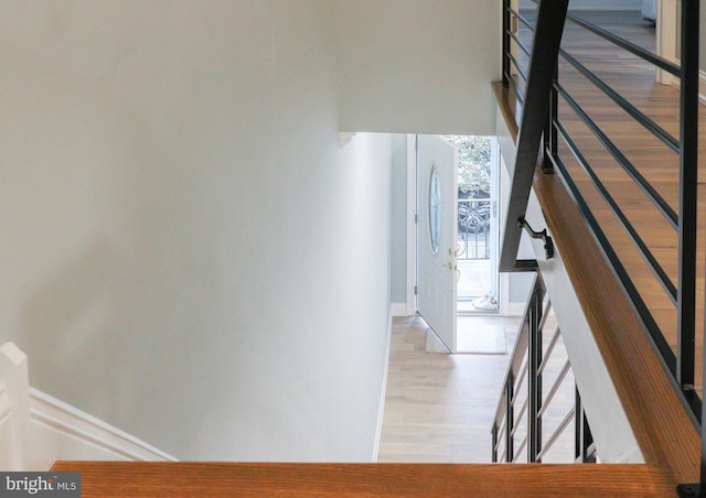 stairway with wood-type flooring