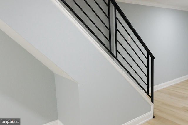 stairs featuring hardwood / wood-style flooring