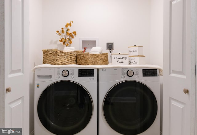 laundry room featuring washer and clothes dryer