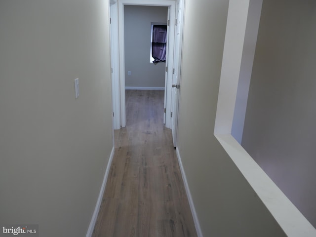 corridor featuring light hardwood / wood-style flooring