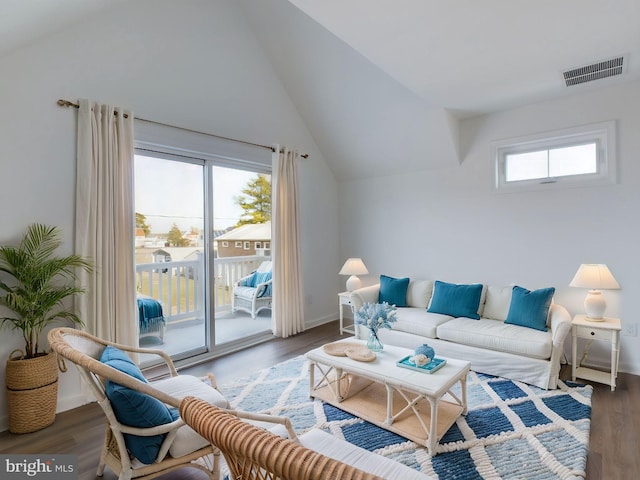 living room with lofted ceiling and hardwood / wood-style flooring